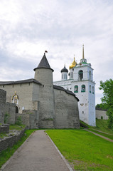 Fototapeta na wymiar View of the bell tower and Holy Trinity Cathedral in the Pskov Kremlin