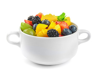 Bowl with delicious fruit salad on white background
