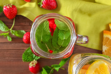 Mason jar of infused water on wooden table