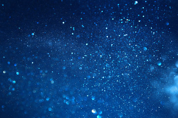 blue glitter vintage lights background. defocused