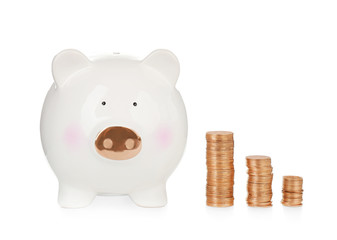 Cute piggy bank with coins on white background