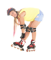 Young woman wearing roller skates against white background