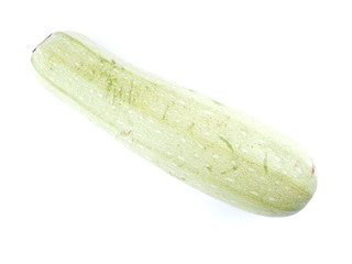 green courgette on white background