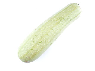 green courgette on white background