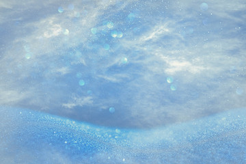 Obraz premium glitter vintage lights background. light blue and silver. de focused