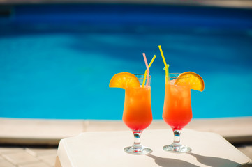 Cocktails on the background of the pool