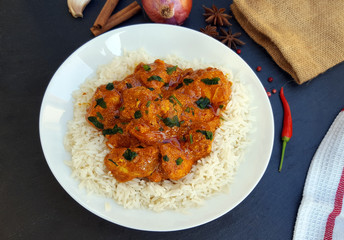 Chicken tikka masala with rice on the table