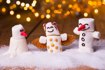 Funny Food Background at Christmas Time  -  Marshmallow Snowmen and Angle