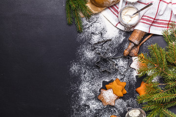Christmas ginger cookies on a black background, horizontal