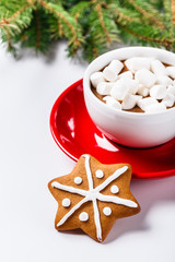 Christmas cookies in a white wooden box with hot chocolate and marshmelow, on a light background.