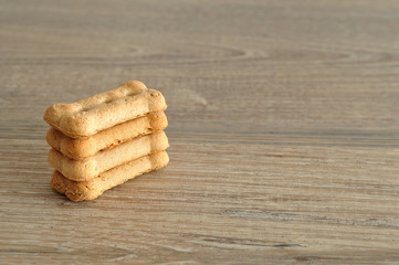 Dog biscuits isolated on a wooden background