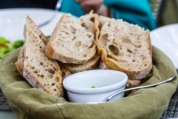 The bread is from the basket with green butter.