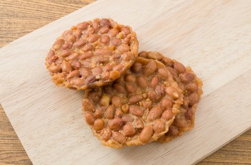 Delicious Thai Snack Peanut Cracker on Wooden Board