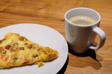 Cup of Hot Coffee with Delicious Pizza