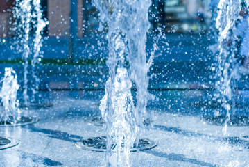 The gush of water of a fountain. Splash of water in the fountain, abstract image