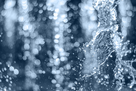 The gush of water of a fountain. Splash of water in the fountain, abstract image