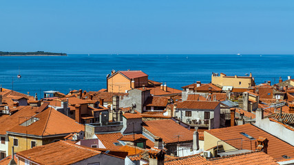 Aerial view of Piran, town on the Adriatic Sea, one of Slovenia's major tourist attractions, with medieval architecture, narrow streets and compact houses.