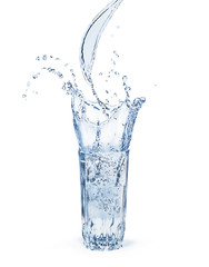 Fototapeta na wymiar a glass of water with a splash isolated on a white background