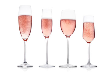 Champagne rose glasses with bubbles on white