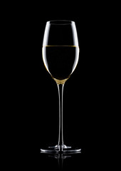 Glass of white wine with reflection on black