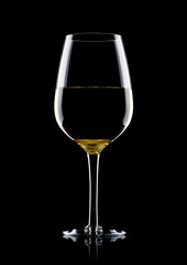 Naklejka na ściany i meble Glass of white wine with reflection on black