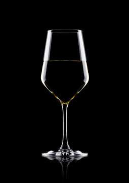 Glass Of White Wine With Reflection On Black