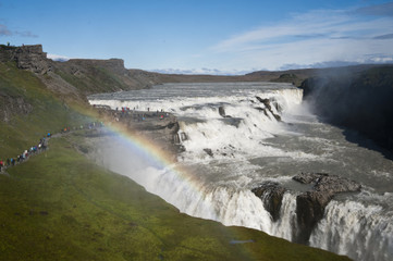 Typical Icelandic landscape of Gullfos Falls, a wild nature of rocks and shrubs.