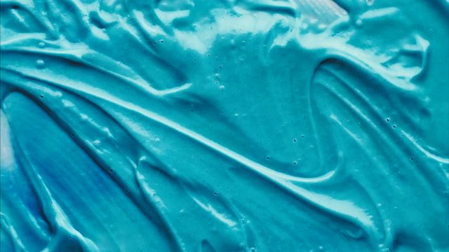 Abstract liquid material motion in macro view. Seamless aqua patterns in stop motion. Loopable bizzare texture background.