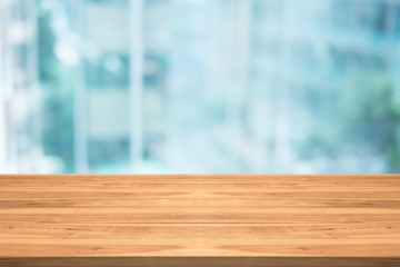 Empty wood table top on blurred background at office building,copyspace for montage your products