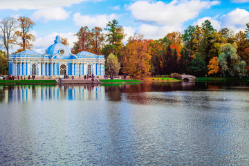 Fototapeta na wymiar Autumn landscape with view over a garden pavilion 