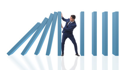 Businessman in domino effect business concept