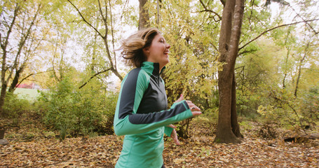 Naklejka na ściany i meble Runner Woman Running In Woods Exercising Outdoors