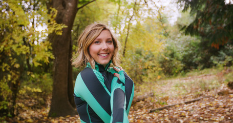 Runner Woman In Woods Exercising Outdoors Stretching