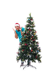 Young man decorating christmas tree isolated on white