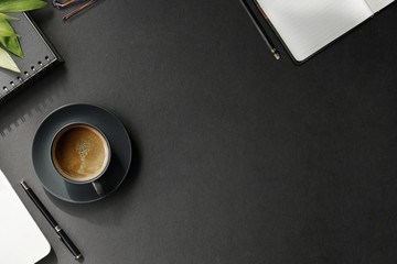 Work space concept : Office dark desk table with computer and supplies. Top view with copy space