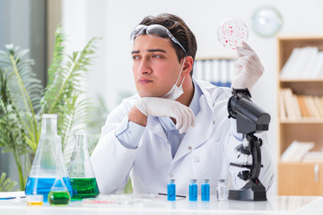 Male doctor working in the lab on virus vaccine