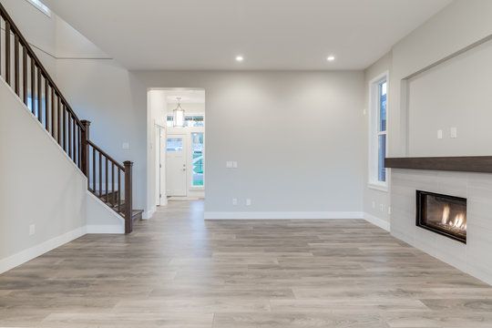 Interior Of A Modern Living Room With Hardwood Floors And Fireplace.