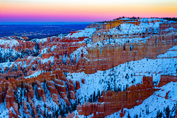 Fototapeta na wymiar Glorious Bryce Canyon National Park in the winter with snow at sunset in Utah.