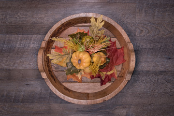 Welcoming Fall with basket of cute mini white and orange pumpkins