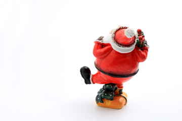 Happy Christmas Santa Claus doll with christmas decorations box isolated on white background with copy space.