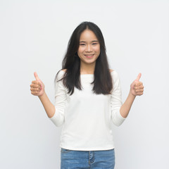 Happy young woman giving thumbs up isolated on white  background
