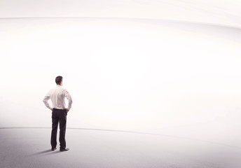 Businessman with briefcase standing still