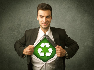 Enviromentalist business man tearing off shirt with recycle sign