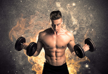Healthy hot male showing muscles with fire