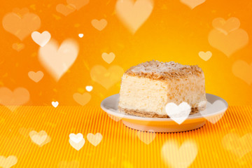 Delicious party cakes with heart shape symbols on colorful background