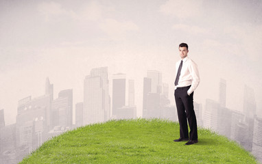 Fototapeta na wymiar man standing in front of city landscape