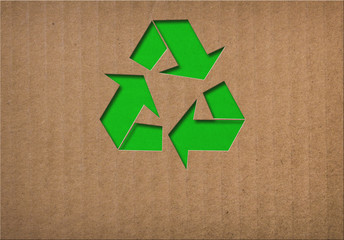 recycle symbol on cardboard texture