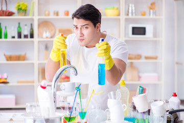 Man enjoying dish washing chores at home