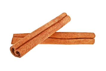 Two cinnamon sticks isolated on a white background. Close up.