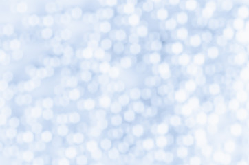 Blue and white bokeh abstract background.
